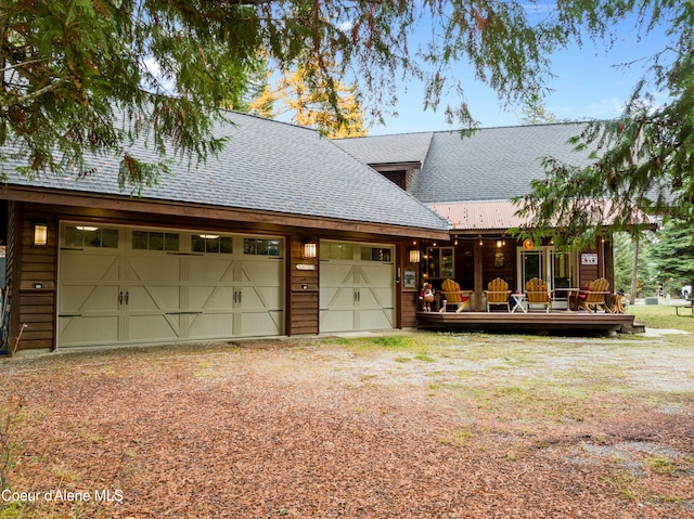 view of front of house featuring a wooden deck and a garage