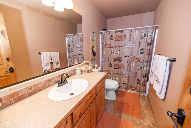 bathroom with vanity, tile flooring, tasteful backsplash, and toilet