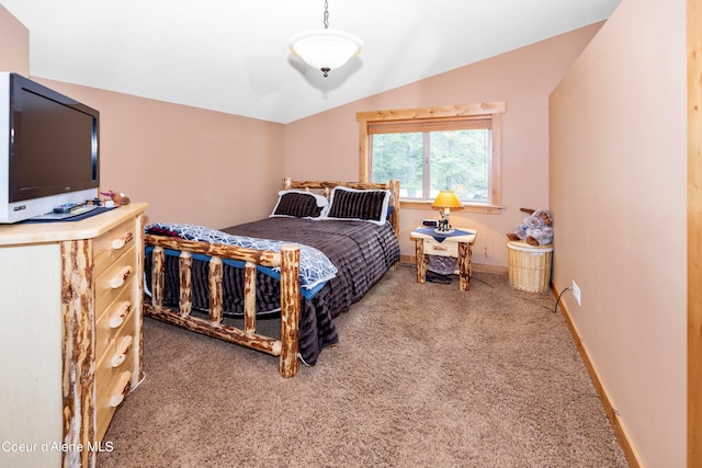 carpeted bedroom featuring lofted ceiling