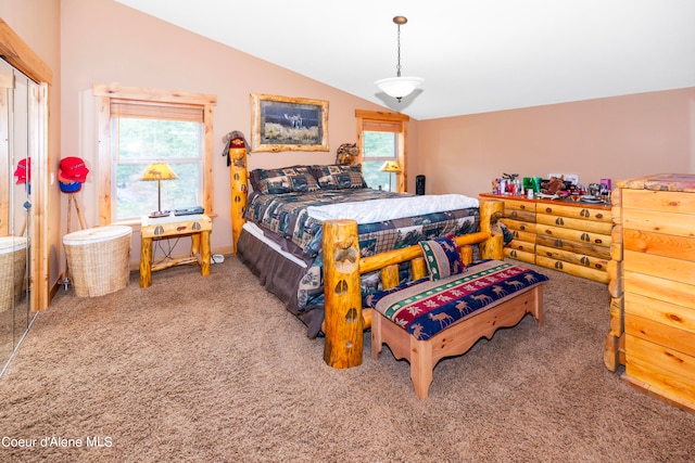 bedroom featuring carpet and vaulted ceiling