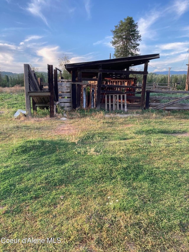 view of yard with a rural view