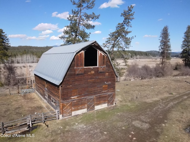 exterior space with an outdoor structure and a rural view