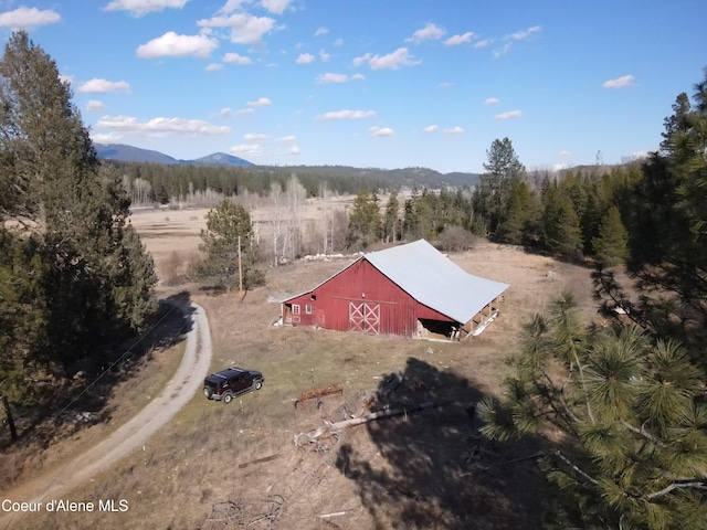 drone / aerial view featuring a mountain view and a rural view