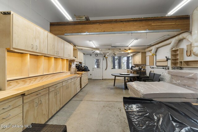 2772 W Lutherhaven Rd, Coeur Dalene, ID 83814 - kitchen featuring wooden counters, light brown cabinets, and unfinished concrete flooring