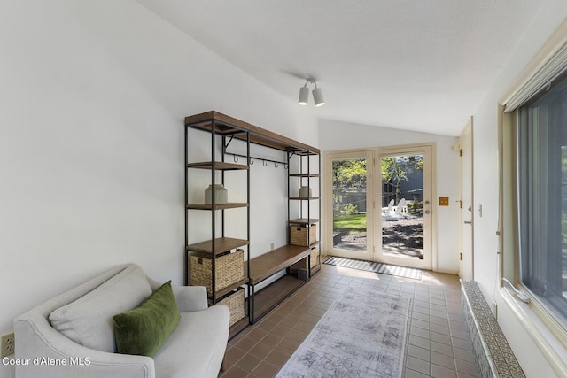 2772 W Lutherhaven Rd, Coeur Dalene, ID 83814 - interior space with dark tile patterned floors and lofted ceiling