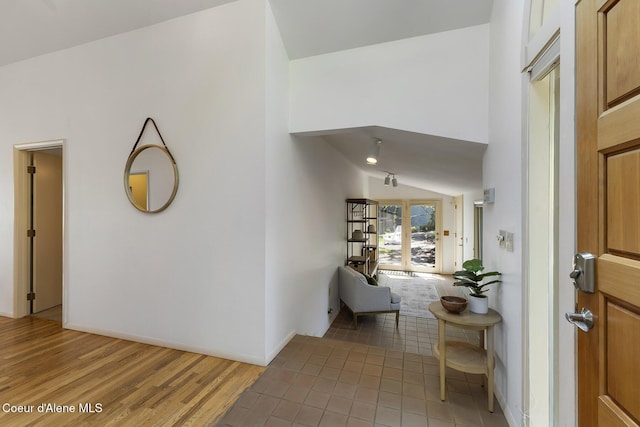 2772 W Lutherhaven Rd, Coeur Dalene, ID 83814 - entryway with light wood-style floors and vaulted ceiling