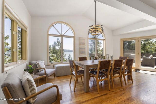 2772 W Lutherhaven Rd, Coeur Dalene, ID 83814 - dining area with a notable chandelier, a wealth of natural light, and light wood-type flooring