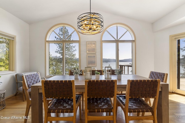 2772 W Lutherhaven Rd, Coeur Dalene, ID 83814 - dining room with a notable chandelier, a healthy amount of sunlight, and light wood-style floors
