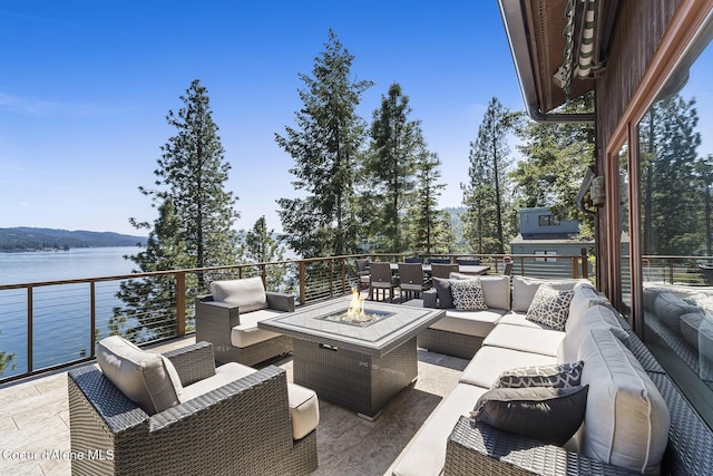 2772 W Lutherhaven Rd, Coeur Dalene, ID 83814 - view of patio / terrace with an outdoor living space with a fire pit and a water view