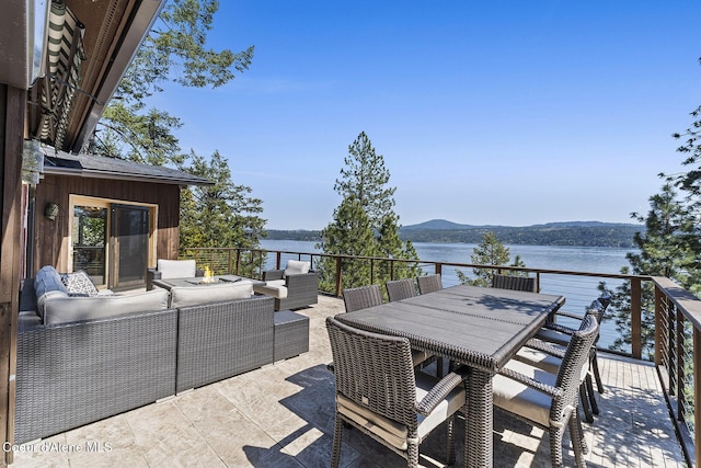2772 W Lutherhaven Rd, Coeur Dalene, ID 83814 - view of patio / terrace with a water view and an outdoor living space