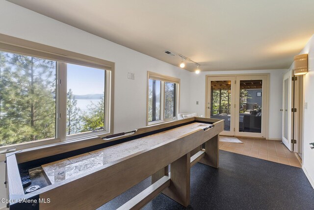2772 W Lutherhaven Rd, Coeur Dalene, ID 83814 - playroom with track lighting, french doors, and visible vents