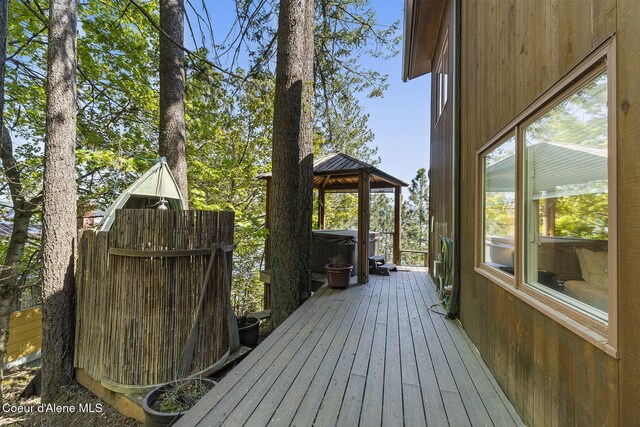 2772 W Lutherhaven Rd, Coeur Dalene, ID 83814 - deck with a hot tub and a gazebo