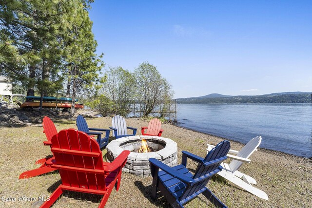 2772 W Lutherhaven Rd, Coeur Dalene, ID 83814 - exterior space featuring an outdoor fire pit and a water and mountain view