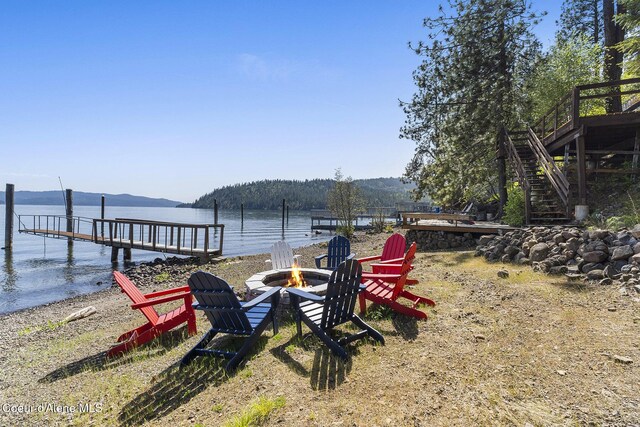 2772 W Lutherhaven Rd, Coeur Dalene, ID 83814 - dock area with stairway, a fire pit, and a water and mountain view