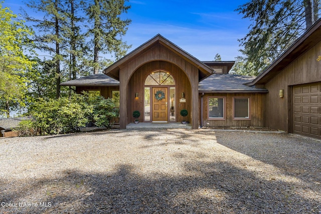 2772 W Lutherhaven Rd, Coeur Dalene, ID 83814 - property entrance featuring roof with shingles and a garage