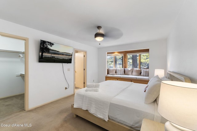 2772 W Lutherhaven Rd, Coeur Dalene, ID 83814 - bedroom featuring light colored carpet, a walk in closet, a closet, and a ceiling fan