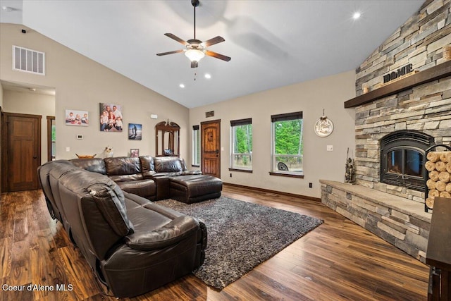 living room with a fireplace, wood-type flooring, high vaulted ceiling, and ceiling fan