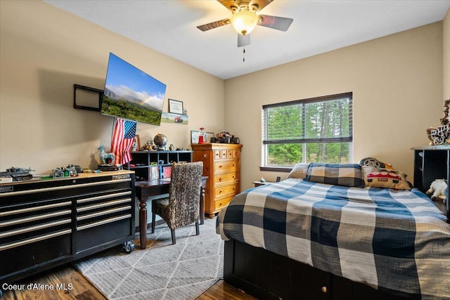 bedroom featuring hardwood / wood-style floors and ceiling fan