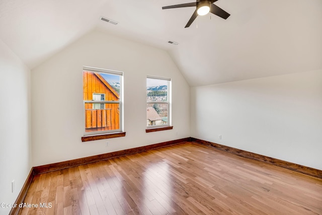 bonus room with light hardwood / wood-style floors, ceiling fan, and lofted ceiling