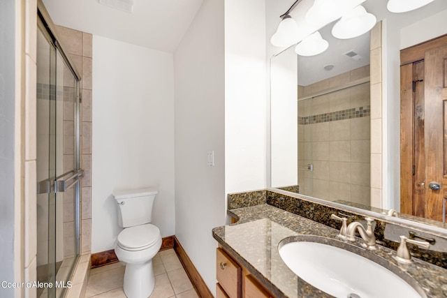 bathroom with tile floors, walk in shower, toilet, and vanity