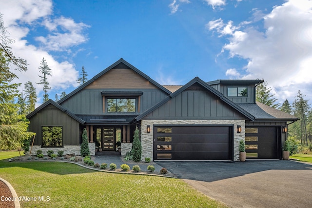 craftsman-style house with a garage and a front lawn