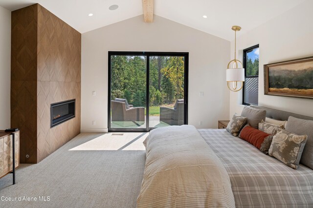 bedroom featuring light carpet, a tiled fireplace, and access to outside