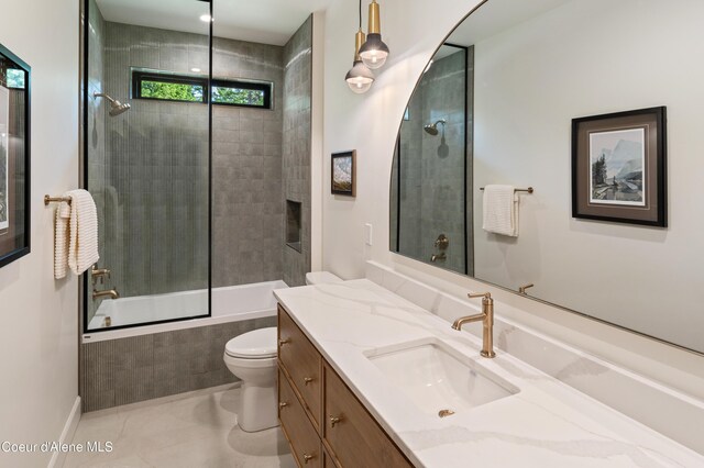 full bathroom with tile patterned flooring, enclosed tub / shower combo, toilet, and vanity