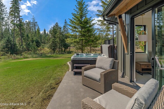 view of patio with a hot tub