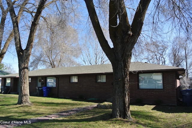 view of side of home featuring a yard