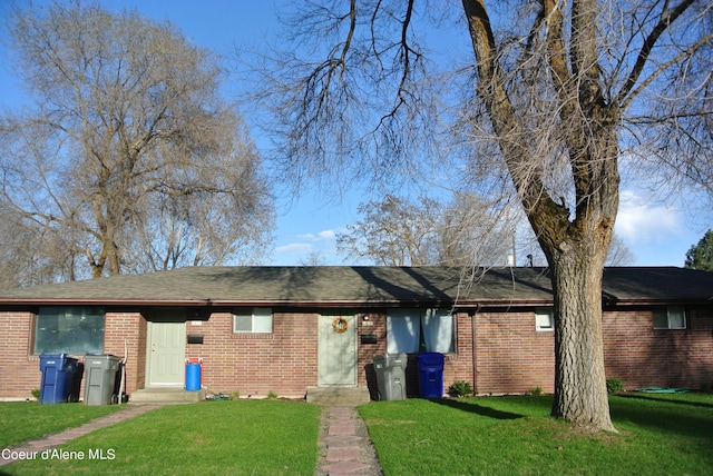 ranch-style house with a front lawn