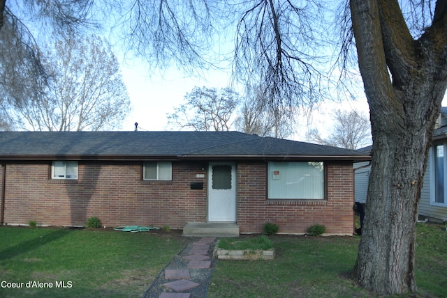 ranch-style house with a front yard