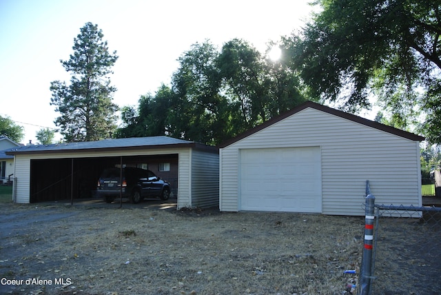 garage featuring a carport