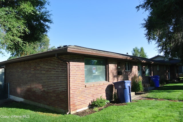 view of home's exterior featuring a lawn