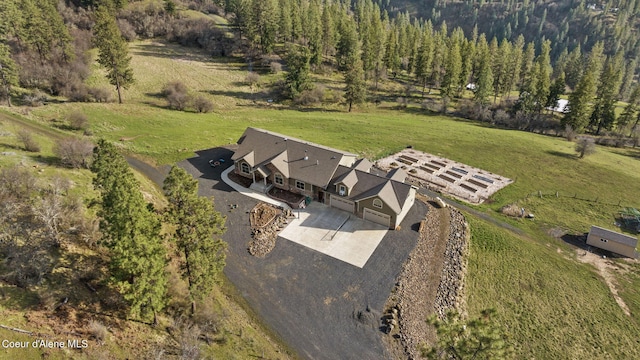 birds eye view of property featuring a rural view