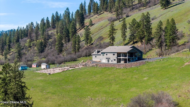 birds eye view of property featuring a rural view