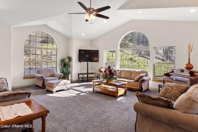 living room with ceiling fan, carpet flooring, and plenty of natural light