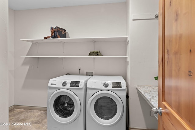 laundry area with light tile flooring, separate washer and dryer, and washer hookup