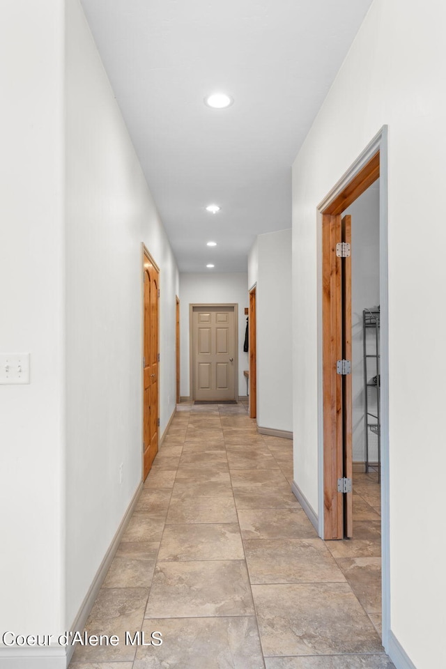 corridor with light tile floors