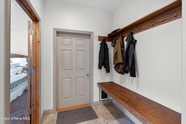 mudroom featuring light tile floors