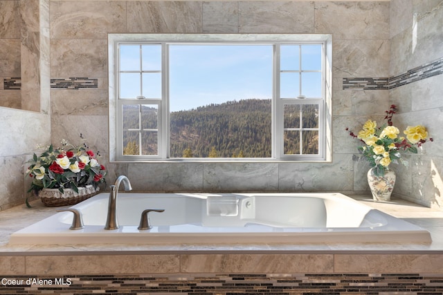 bathroom with tiled tub