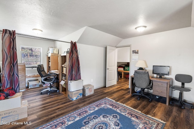 office with dark hardwood / wood-style floors, a textured ceiling, and lofted ceiling