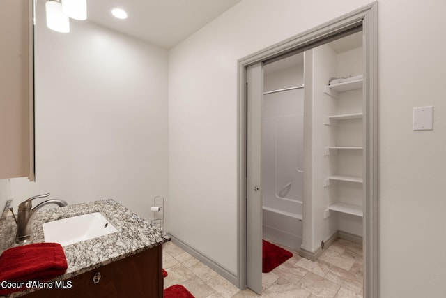 bathroom with shower / washtub combination, tile flooring, and vanity