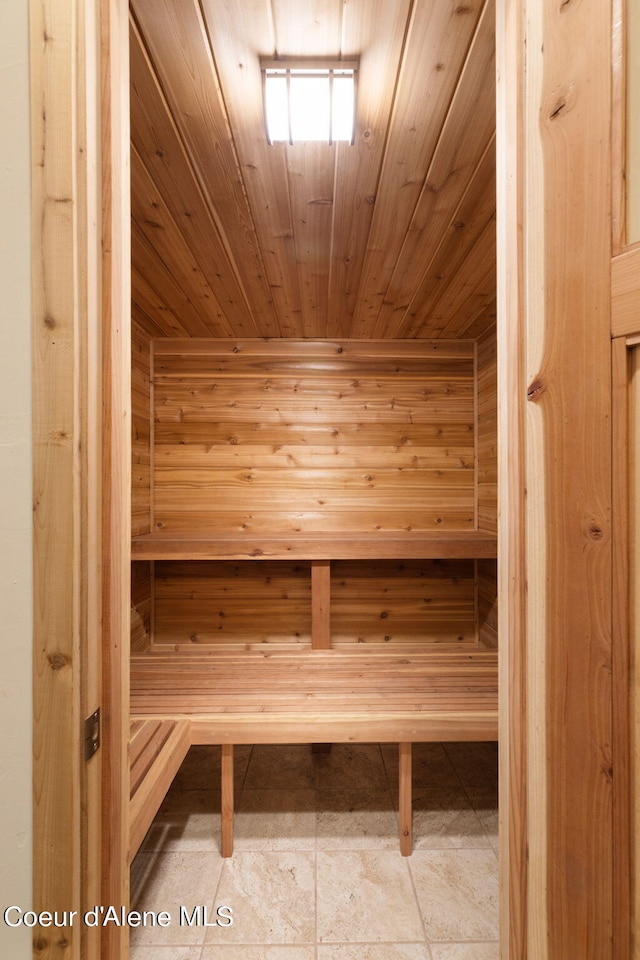 view of sauna featuring tile flooring and wood ceiling