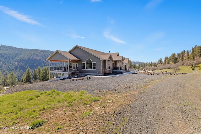 back of house with a mountain view