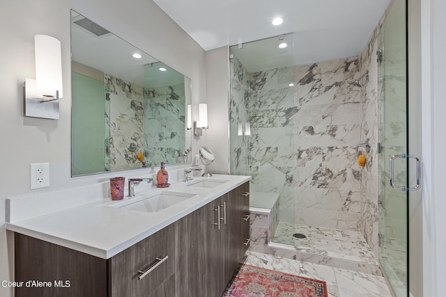 bathroom with double sink vanity and walk in shower