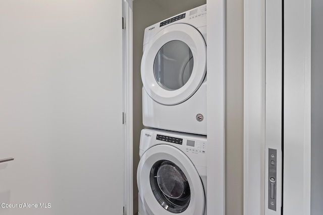 washroom with stacked washer and clothes dryer