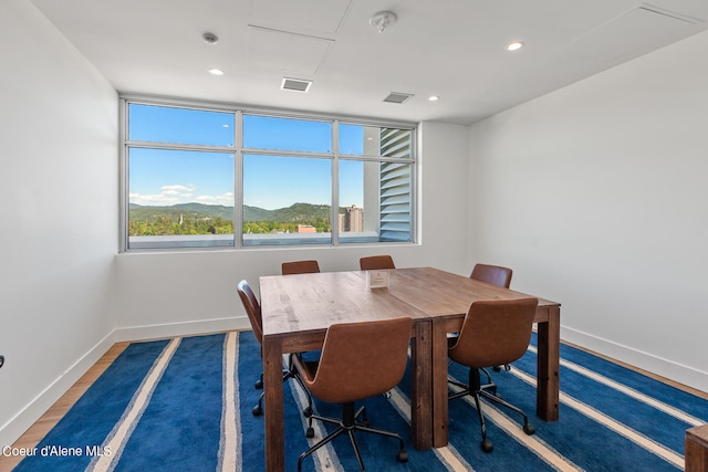 dining area with dark hardwood / wood-style flooring