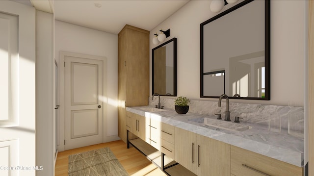 bathroom with double sink, oversized vanity, and hardwood / wood-style flooring