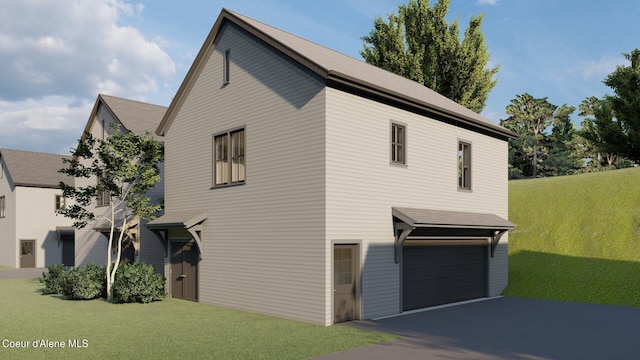 view of front of house featuring a front lawn and a garage