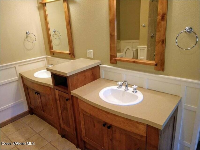 bathroom featuring tile floors and large vanity